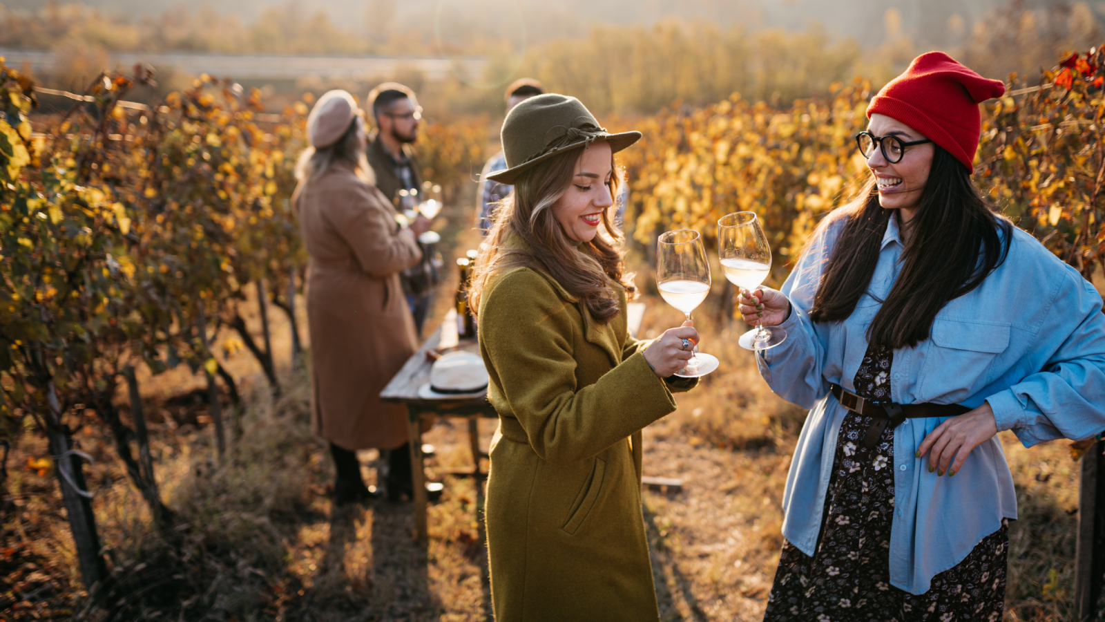 Two women wine tasting in a vineyard