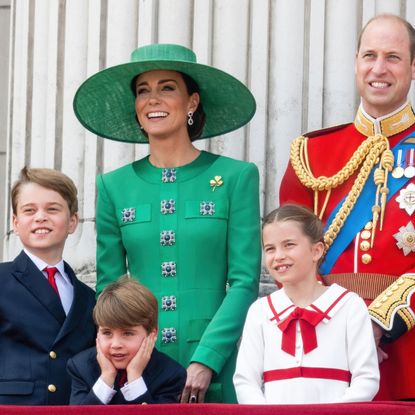 The Wales family waves from the Buckingham Palace balcony during Trooping the Colour in 2023