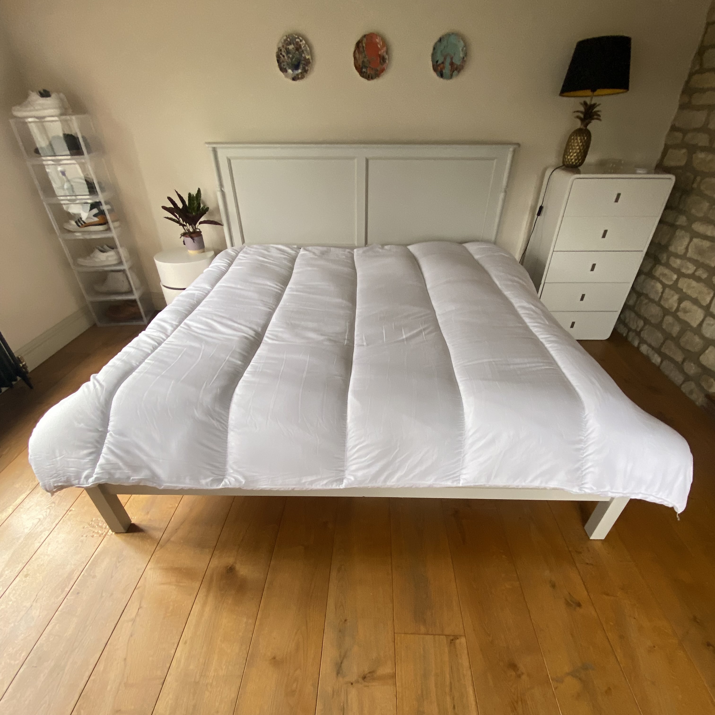 Slumberdown Made For You Two duvet being tested on a bed in a bedroom with a wooden floor