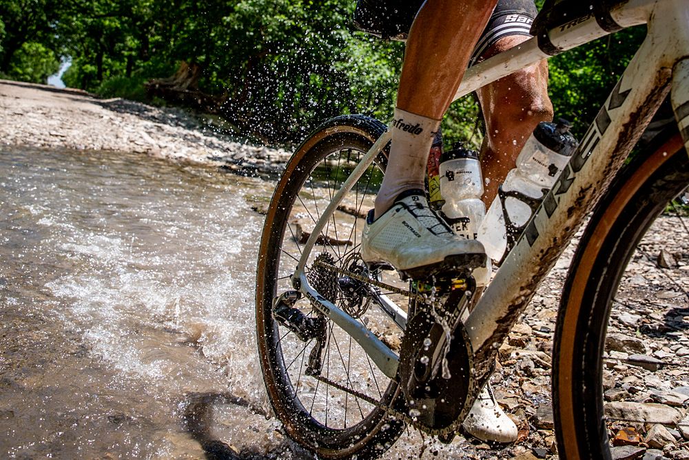 A creek crossing in the later miles brought welcome cooling on a day where temperatures exceeded forecasts and wore down riders.