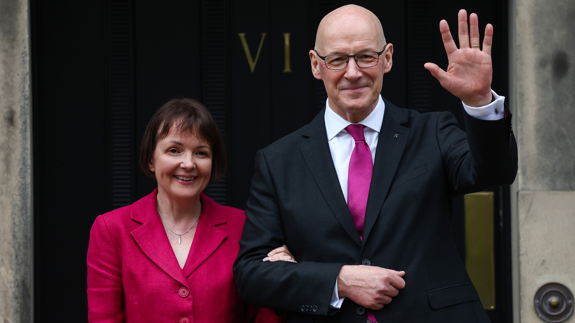 Scotland's new First Minister John Swinney stands on the steps of official residence Bute House in Edinburgh with his wife Elizabeth on 7 May 2024