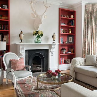 living room with red alcove shelving