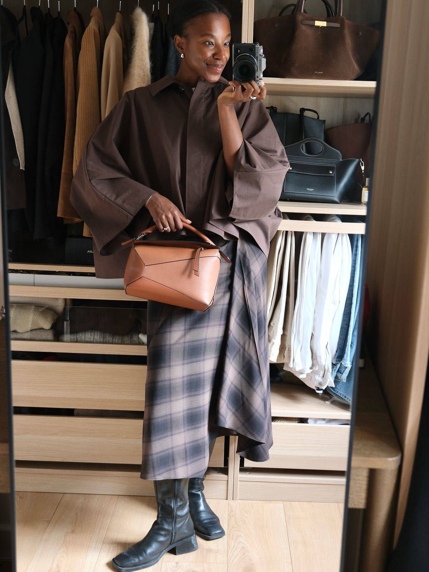 how to wear a kilt in 2026: taffy msipa wears a brown jacket, kilt skirt and leather boots