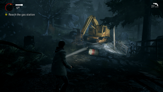 An image of Alan Wake exploring a dark forest