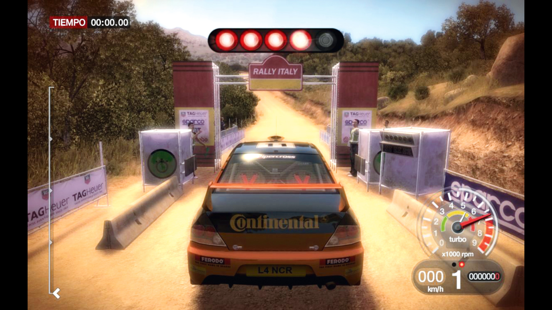 About to begin a race through an orange dirt track in Colin McCrae: Dirt