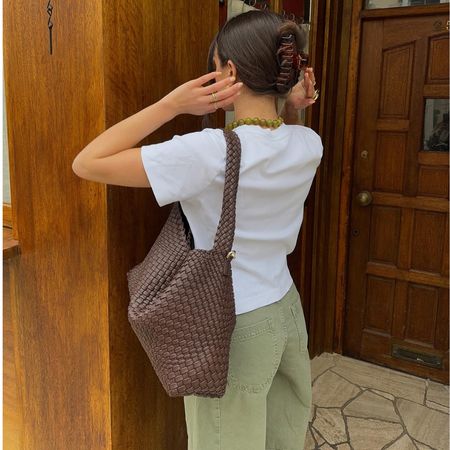 Tia Dewitt wears khaki jeans