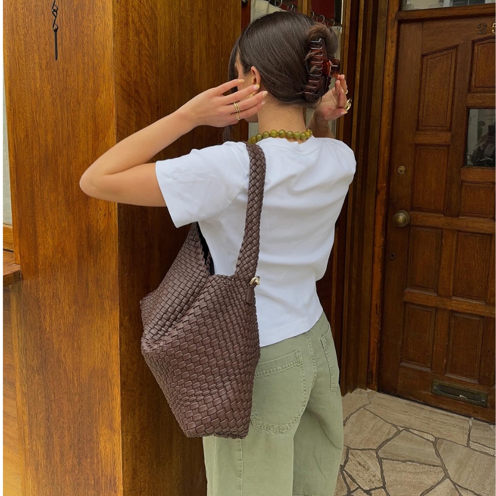 Tia Dewitt wears khaki jeans