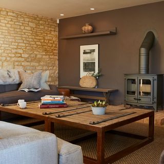living room with dark grey wall and fire place