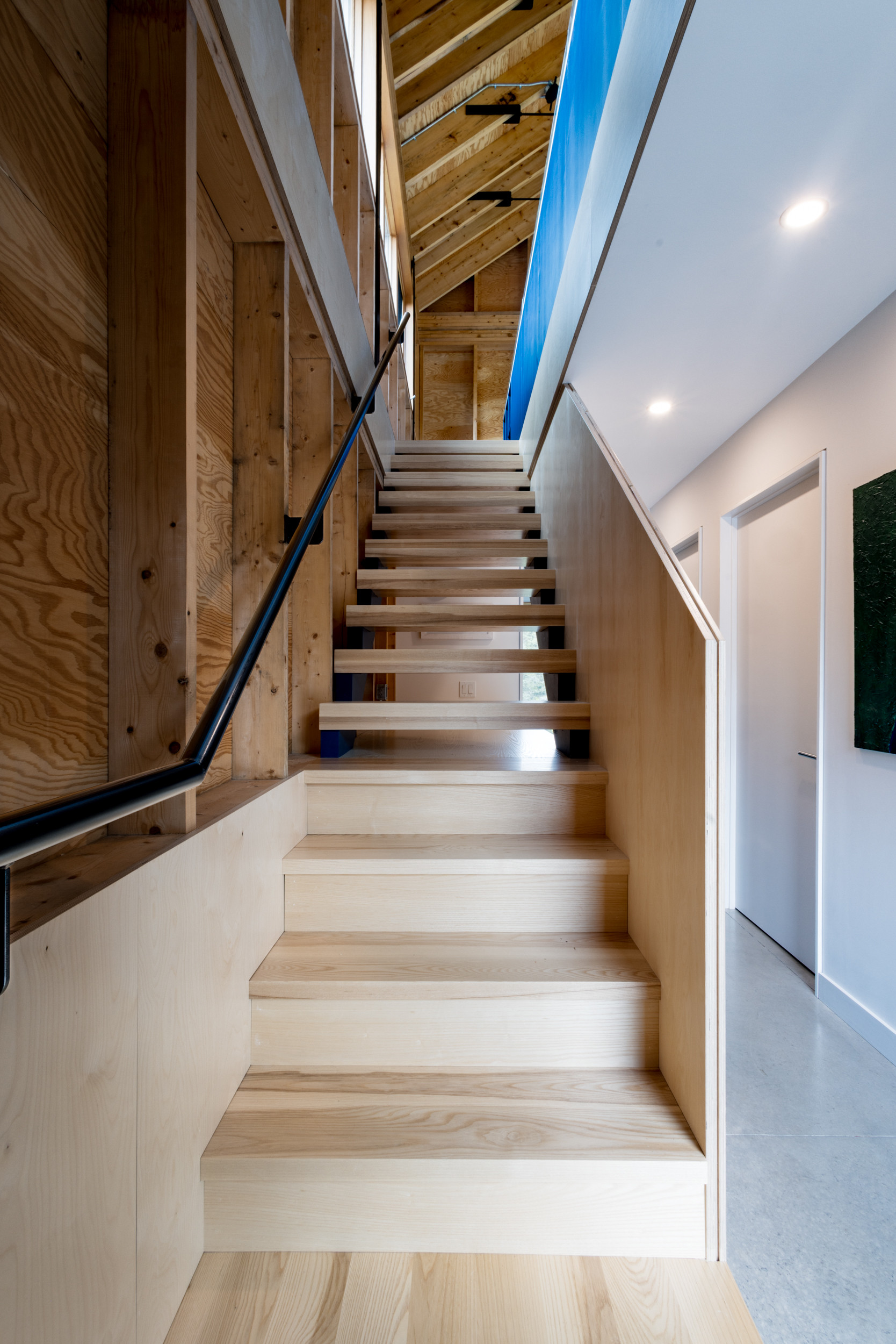 The staircase leads up from the bedrooms to the living area