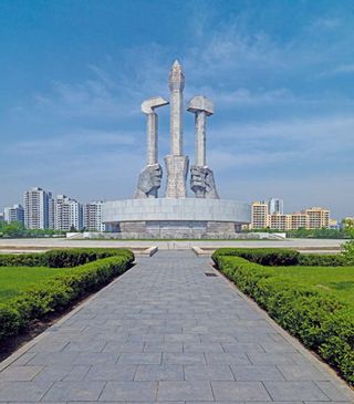 The Party Foundation Monument features the three pillars of society: works