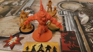 Miniatures, tokens, and cards from Zombicide: Undead or Alive on board tiles
