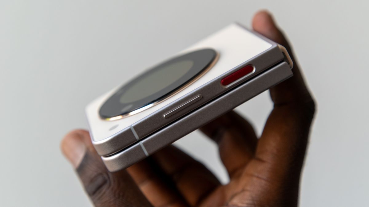 Holding the Nubia Flip 5G from the side to show the fingerprint scanner