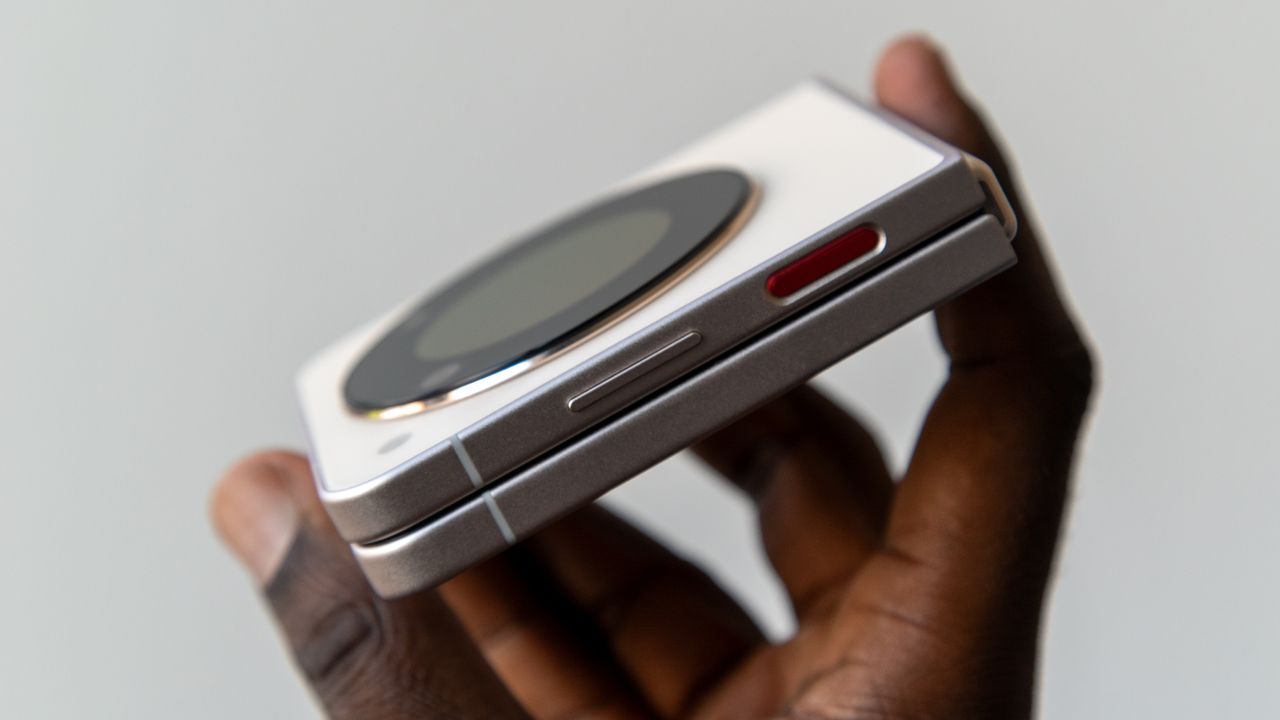 Holding the Nubia Flip 5G from the side to show the fingerprint scanner