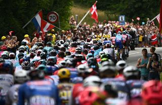 The pack of riders cycles during the 3rd stage of the 109th edition of the Tour de France cycling race 182 km between Vejle and Sonderborg in Denmark on July 3 2022 Photo by AnneChristine POUJOULAT AFP Photo by ANNECHRISTINE POUJOULATAFP via Getty Images