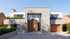 A modern home with a contemporary front door and garage door