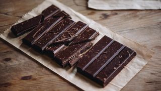 A dark chocolate bar chopped into pieces