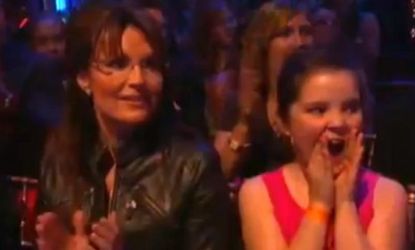 Sarah Palin and youngest daughter, Piper, weather a rowdy audience in support of Bristol's Dancing with the Stars quickstep.
