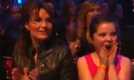 Sarah Palin and youngest daughter, Piper, weather a rowdy audience in support of Bristol&amp;#039;s Dancing with the Stars quickstep.