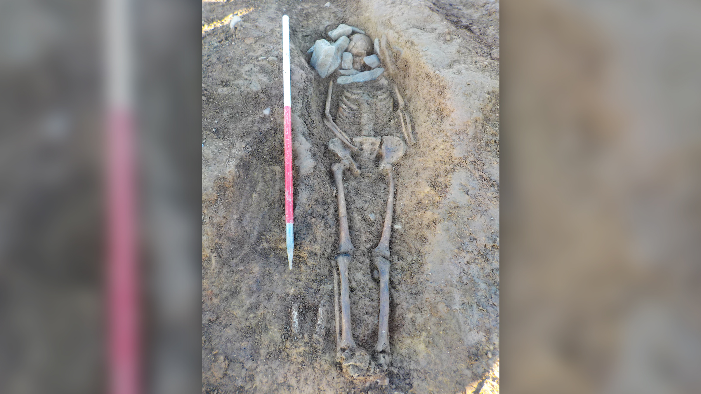 An early medieval skeleton found in burial monument that was first used during the Bronze Age.