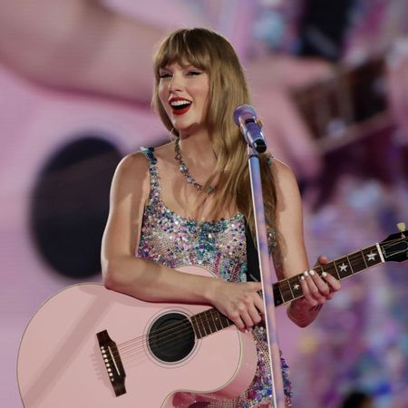 Taylor Swift performing on stage during her Eras Tour