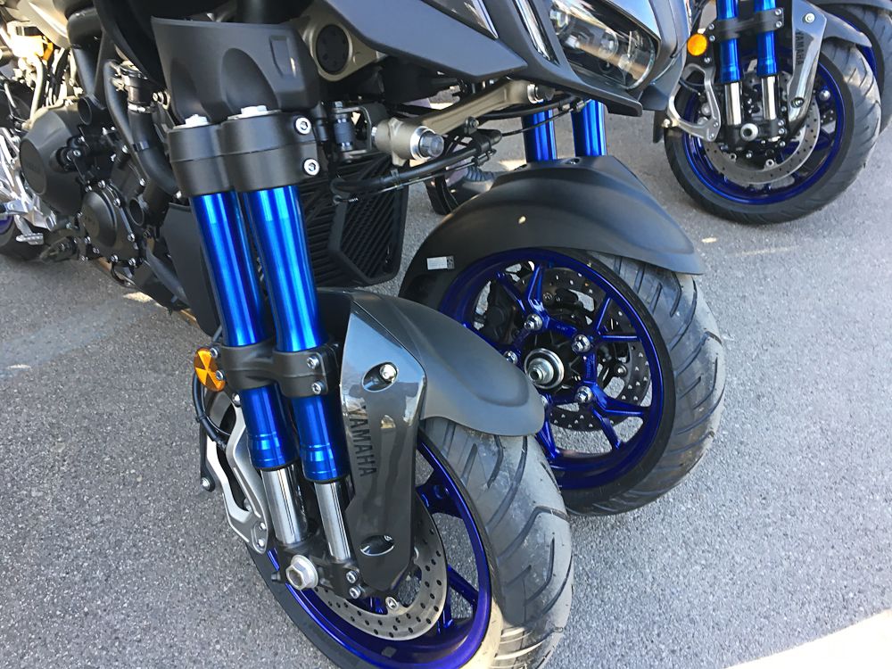 The race motorbikes had the biggest suspension fork in the peloton