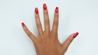 A hand with a red manicure