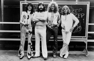 Led Zeppelin posing for the camera backstage