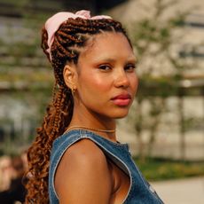 girl in a pink scrunchie with fine lines under eyes