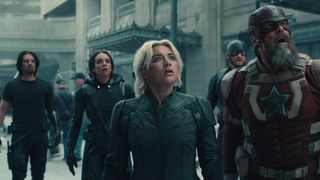 Five superheroes assemble downtown and look up into the sky