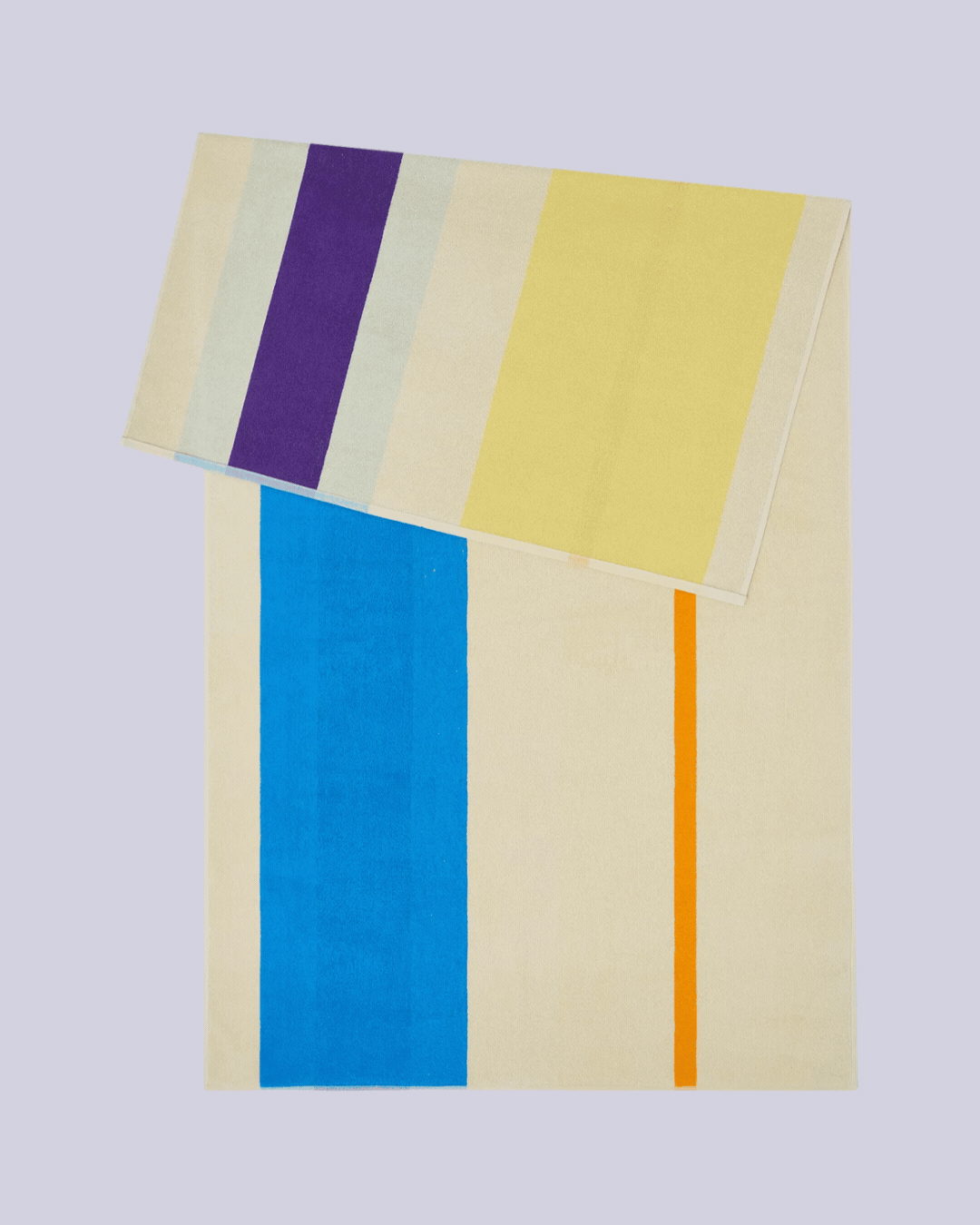 Woven-Stripe Cotton Beach Towel in pastel shades, placed half folded on itself against pale lilac background and shown in rotating gif.