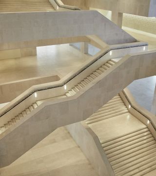Interior showcase the beige staircase design with view of different levels
