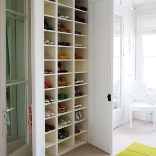 white cupboard with shelves and white wall