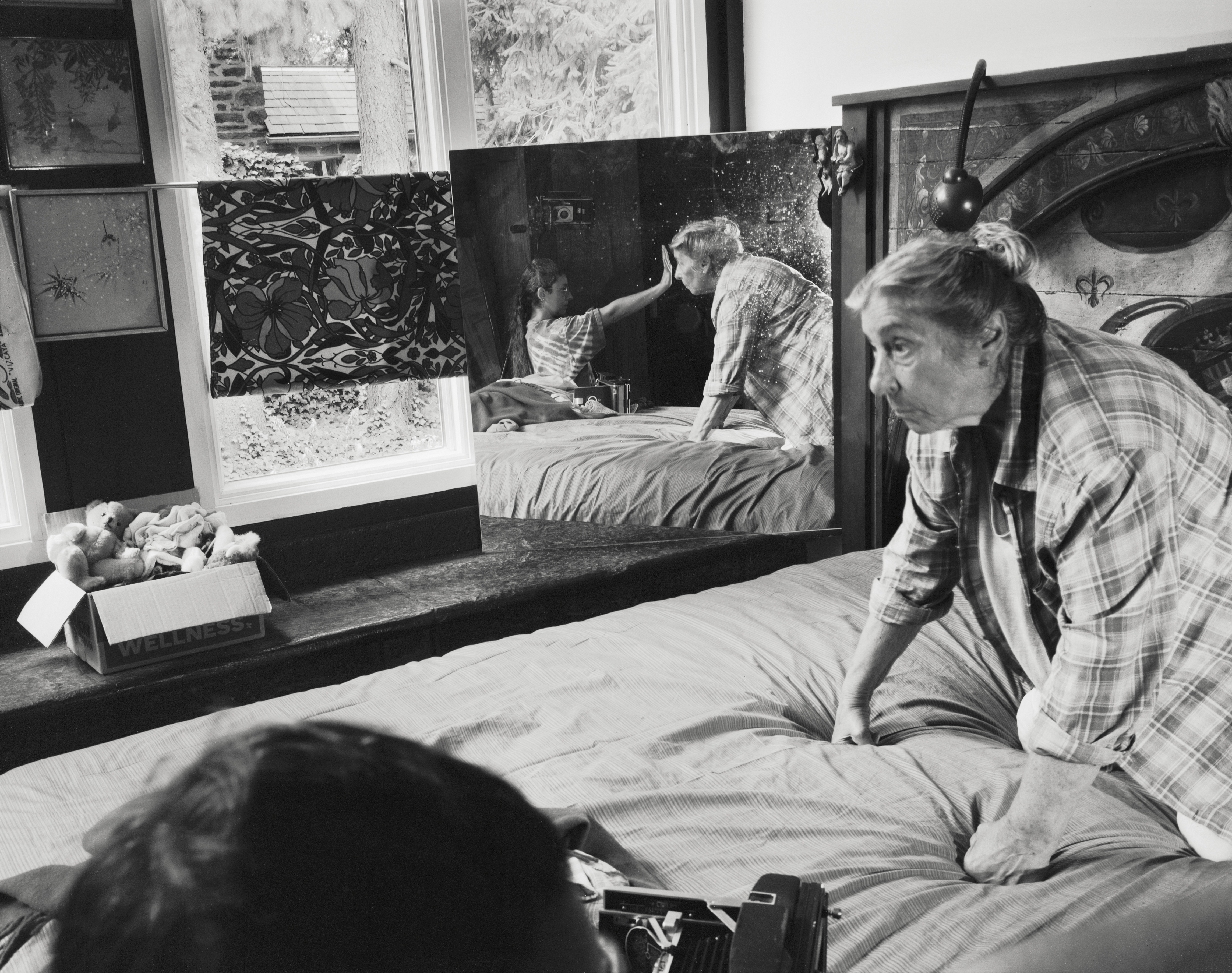 black and white images of an elderly woman in her house