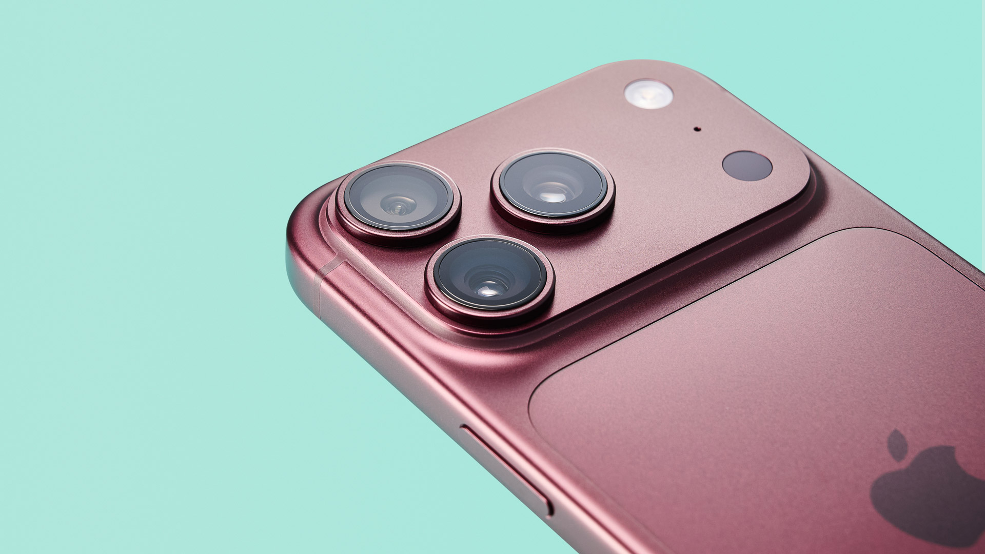 Apple iPhone 18 Pro in burgundy on green background