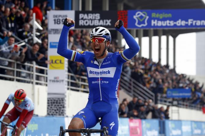 Philippe Gilbert celebrates as he wins Paris-Roubaix