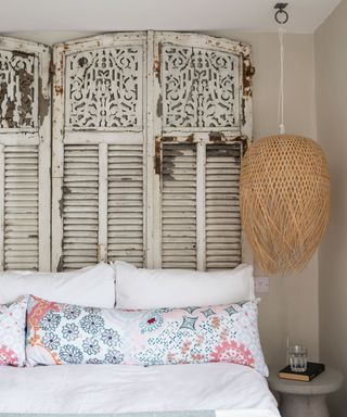 Main bedroom with French vintage shutters as headboard