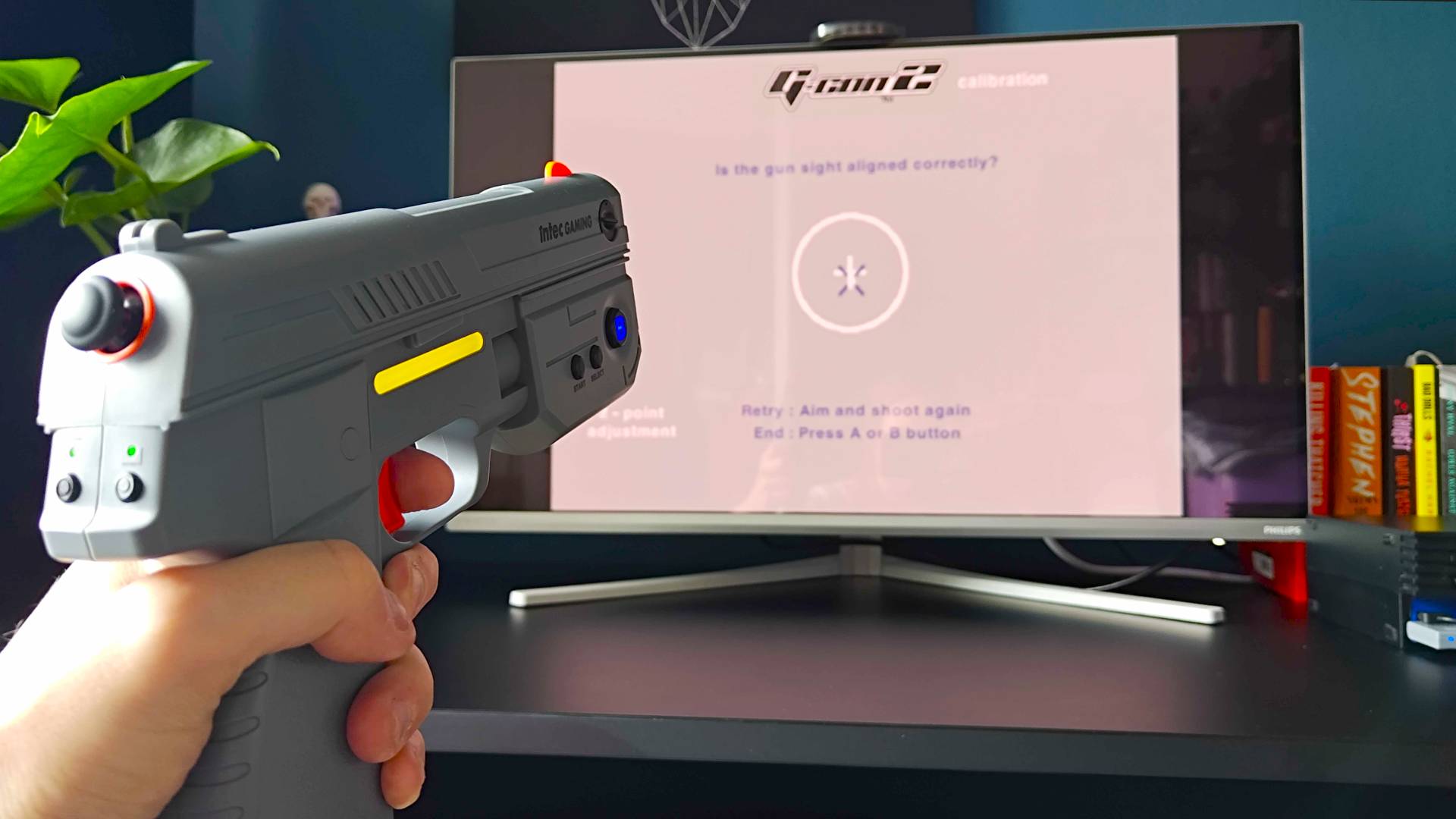 Intec Time Breaker Lightgun pointing at Time Crisis 2 for PS2 calibration screen.