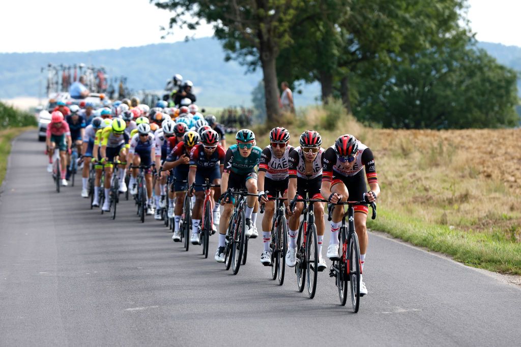 PRZEMYSL POLAND AUGUST 01 LR Diego Uliss of Italy and UAE Team Emirates Rui Oliveira of Portugal and Stake Laengen Vegard of Norway and UAE Team Emirates lead the peloton during the 79th Tour de Pologne 2022 Stage 3 a 2379km stage from Kranik to Przemyl TdP22 WorldTour on August 01 2022 in Przemysl Poland Photo by Bas CzerwinskiGetty Images