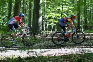 Florian Vermeersch and Jasper Stuyven riding a gravel bike