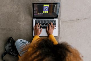 person working on a laptop showing Linearity Move