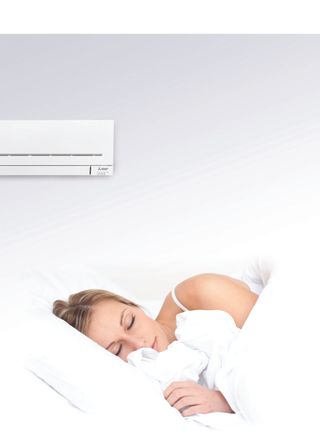 Sleeping woman with air conditioning unit
