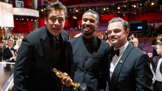 Del Toro, Jordan and DiCaprio pose after the ceremony finishes