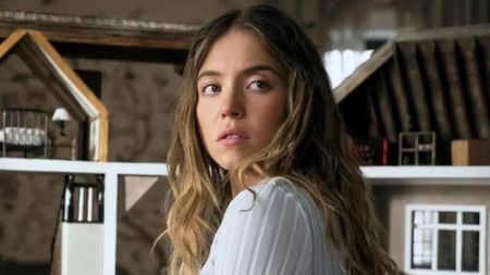 Sydney Sweeney looks over her shoulder