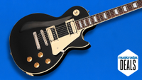 An Epiphone Les Paul electric guitar on a blue background