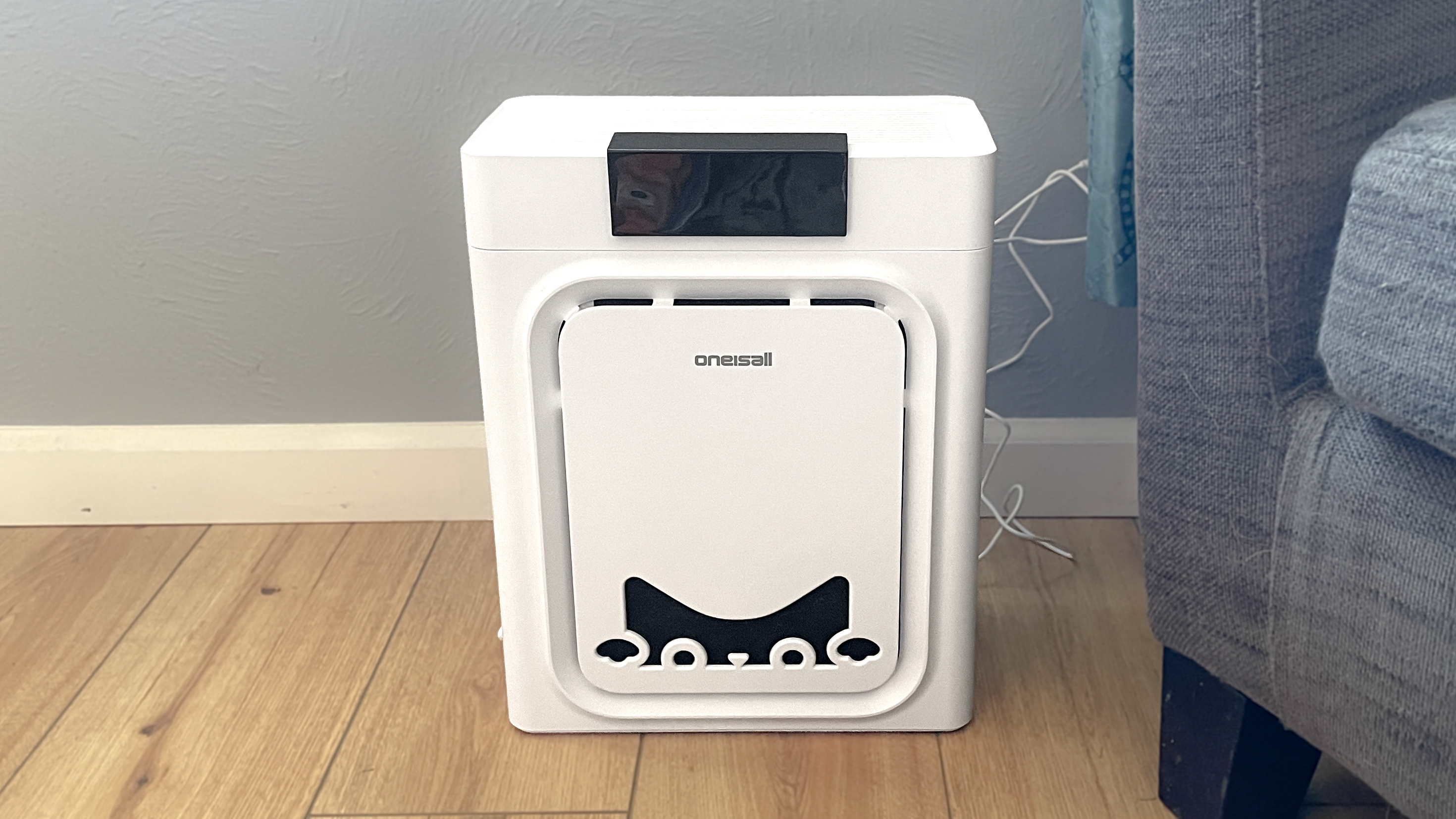 Oneisall air purifier on wooden floor