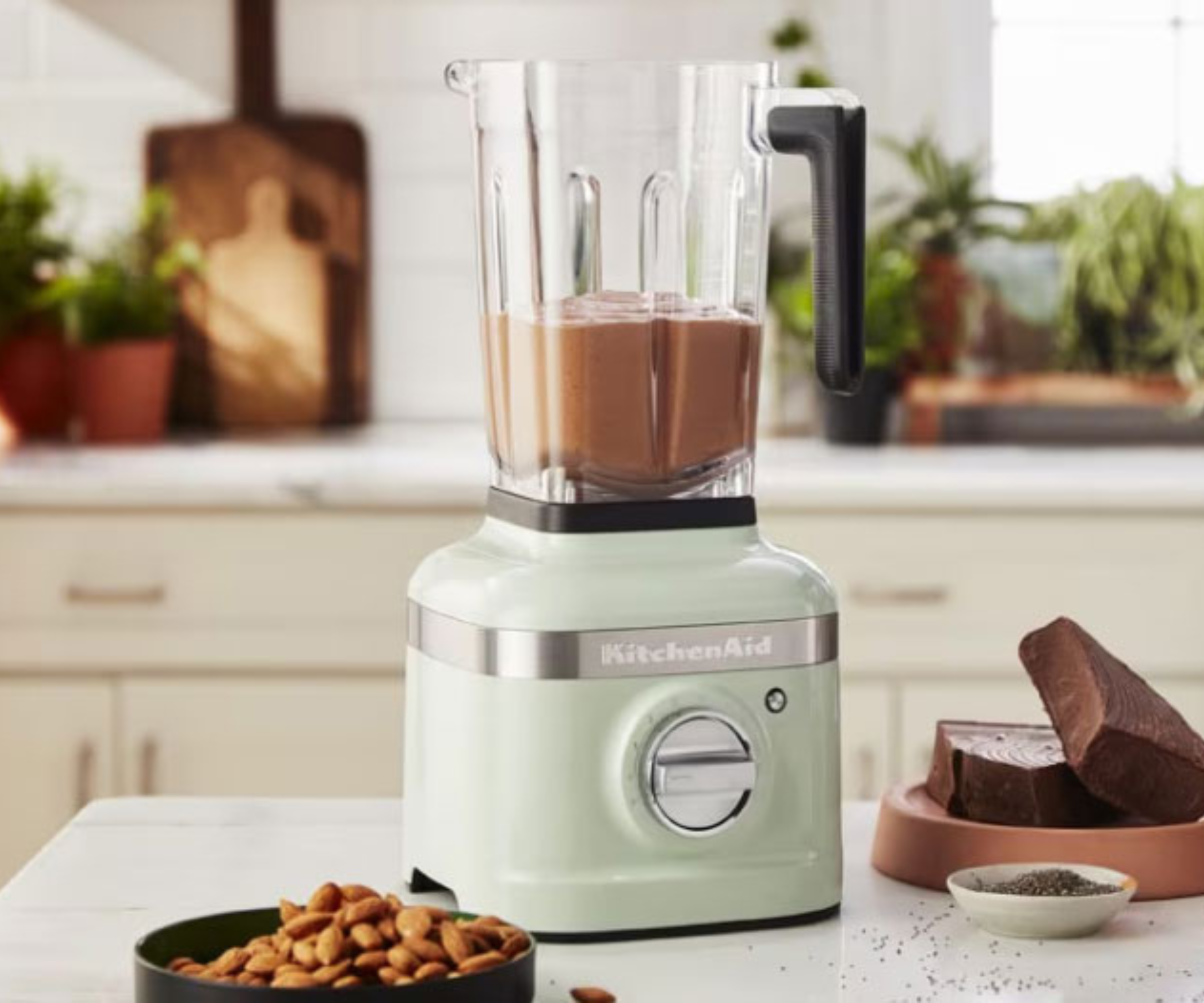 KitchenAid K400 blender in mint green, blending a chocolate mousse