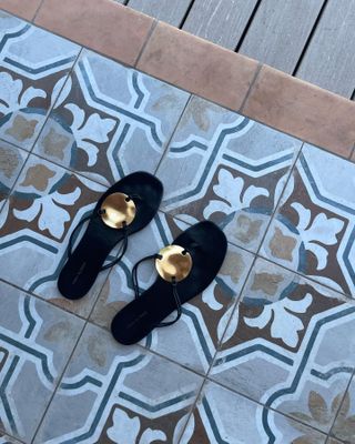 Black embellished Tory Burch sandals.