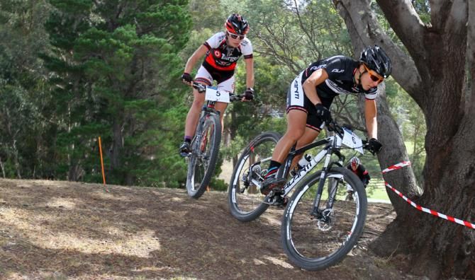 Rowena Fry leads Holly Harris after Emily Parkes crashed