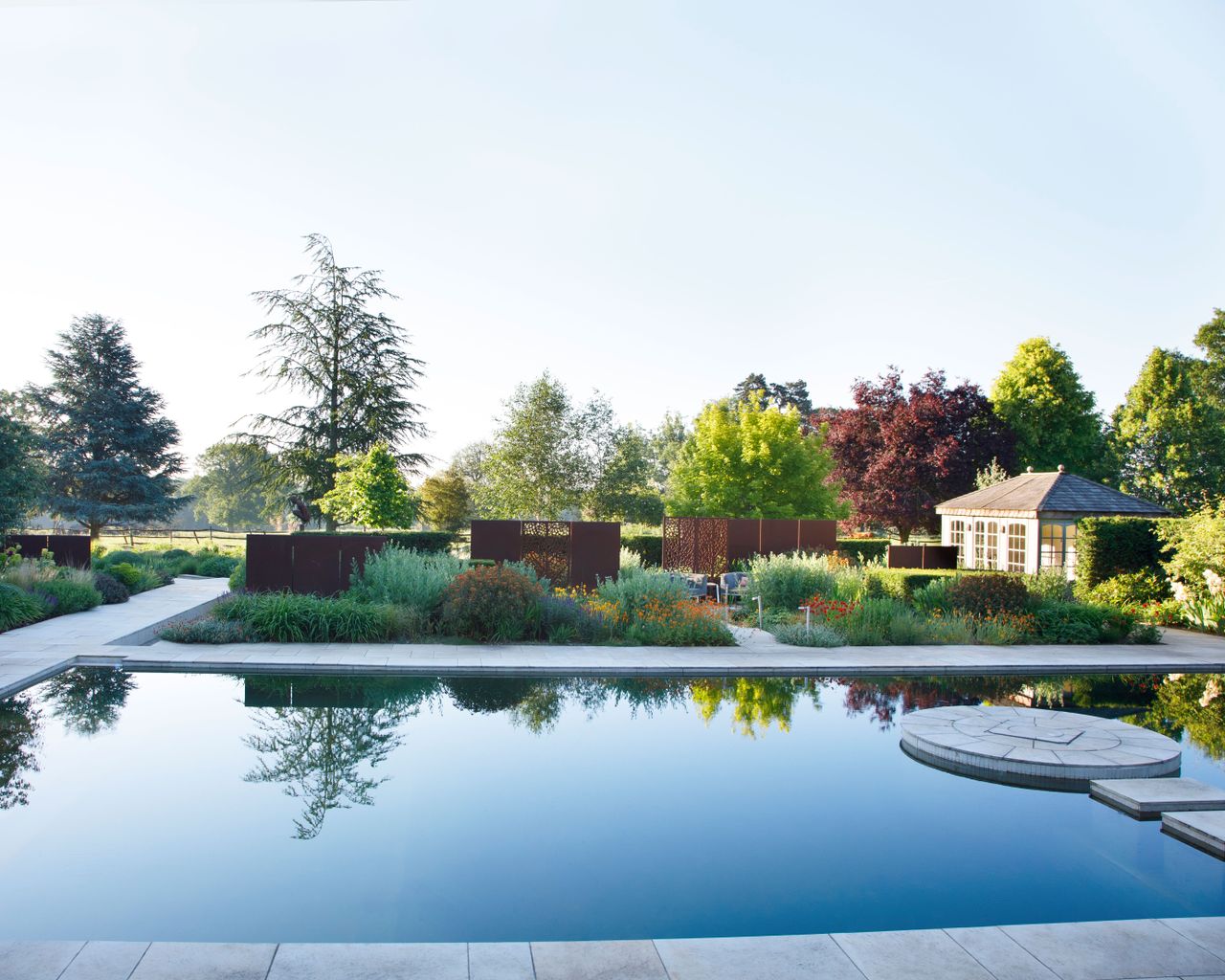 natural garden pol area with surrounding planting