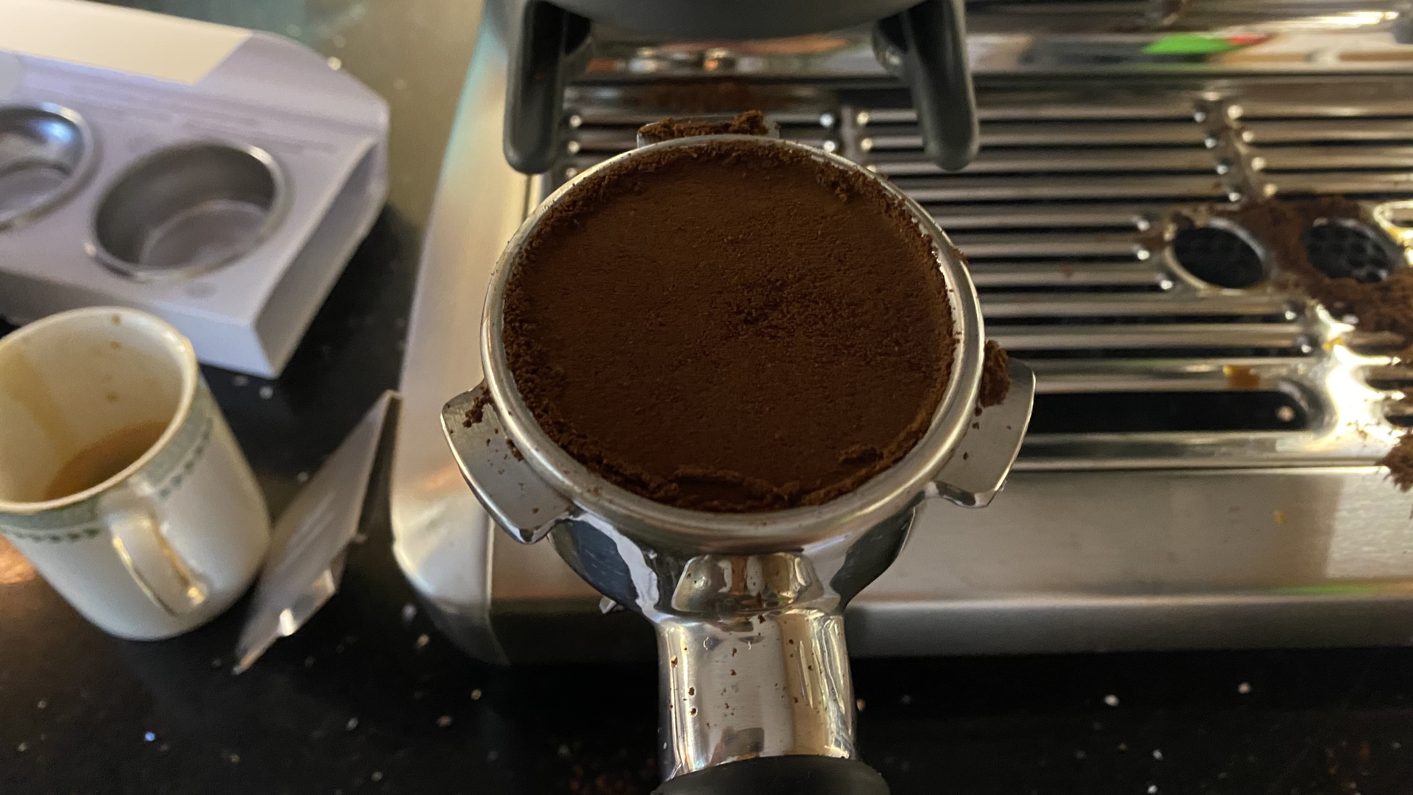 coffee puck after using the tamper and razor